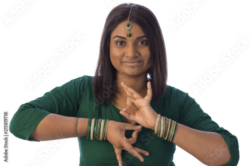 Indian woman in traditional clothing and jewelery smiling