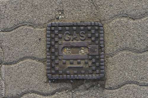 surface box on street made of metal saying 