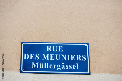 Rue des Meuniers - Mullergassel street sign on the building facade in Strasbourg, Alsace France