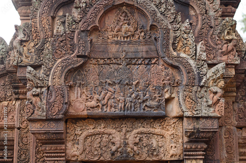 Carved stone decors on Bantai Srei buddhist temple in Angkor Wat park, Cambodia