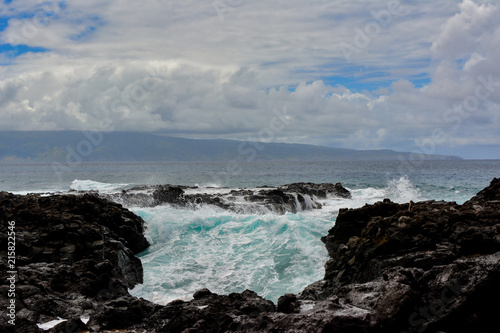 Wave crashing on the rocky coast of Maui, Hawaii