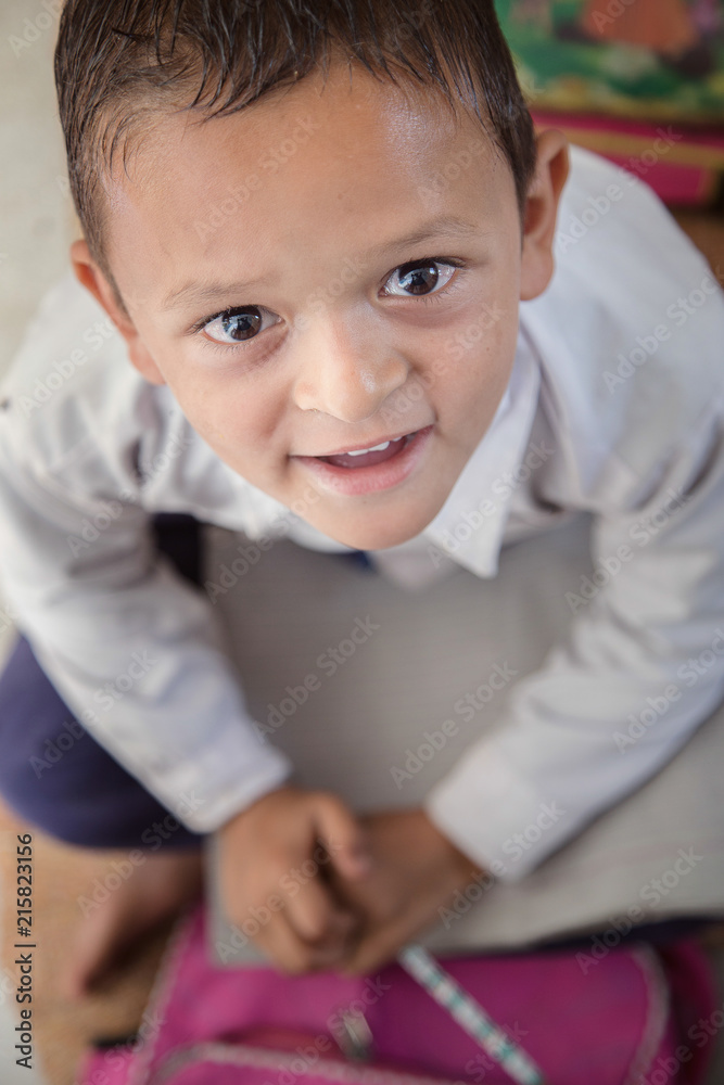 Smiling Indian/Asian Village School Boy Portrait sitting in his classroom. Smiling Indian/Asian Village School Boy Portrait sitting in his classroom.