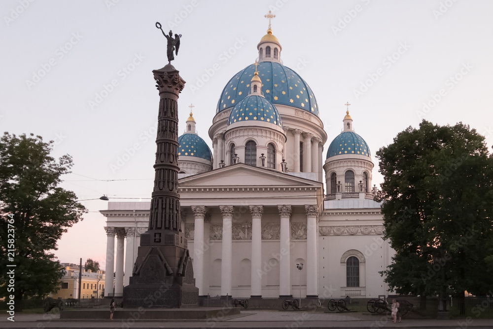 Trinity Izmailovo Cathedral And the column of Glory. The view from the side of the Izmajlovsky prospectus. Russia, St. Petersburg. July 2018.