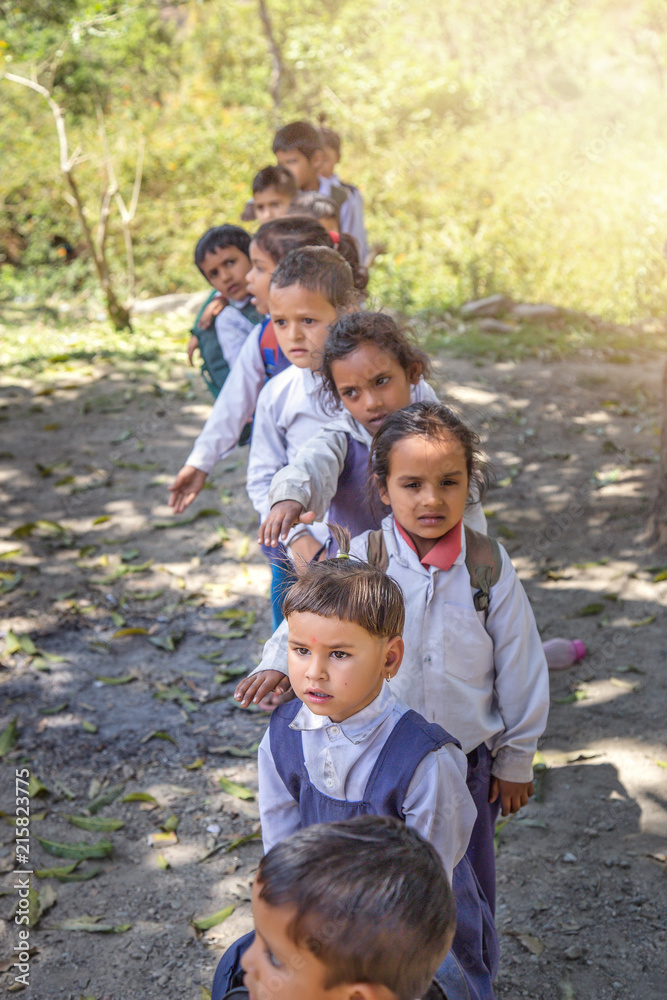 Rural Indian village school children standing outside class for morning prayer. Rural Indian village school children standing outside class for morning prayer.