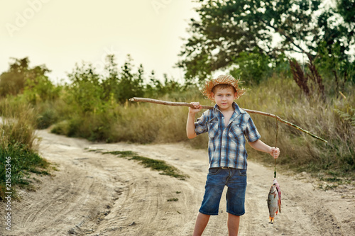 The Fisher boy going fishing .Summer active rest of children