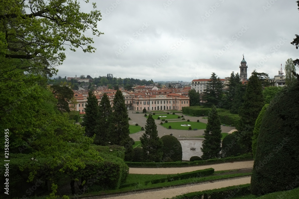 Estense Palace, or Palazzo Estense, the residence of Franchesco III d'Este, Duke of Modena and Reggio, and beautiful green park in front of it, Italy