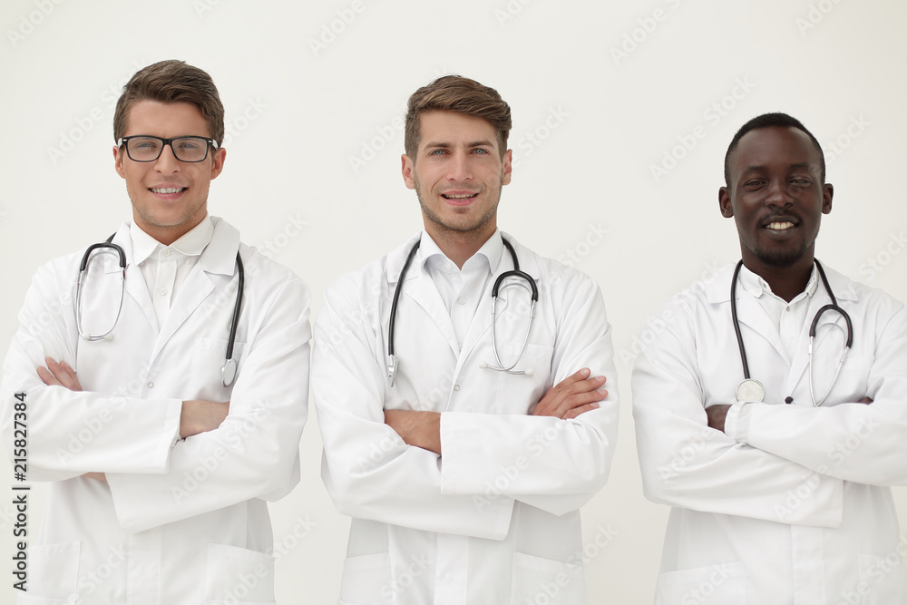 three successful physician therapists standing together three successful physician therapists standing together