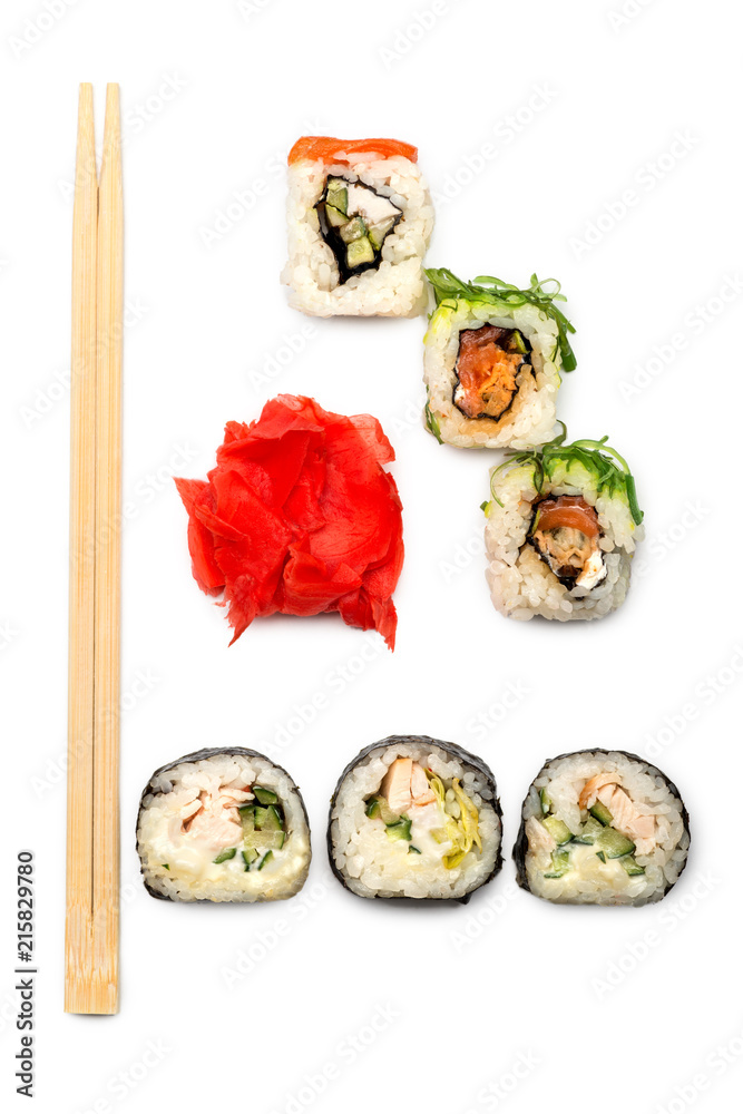 Food abstract background. On the white plane lie rolls or sushi, ginger plates and sticks for sushi. Food abstract background. On the white plane lie rolls or sushi, ginger plates and sticks for sushi.
