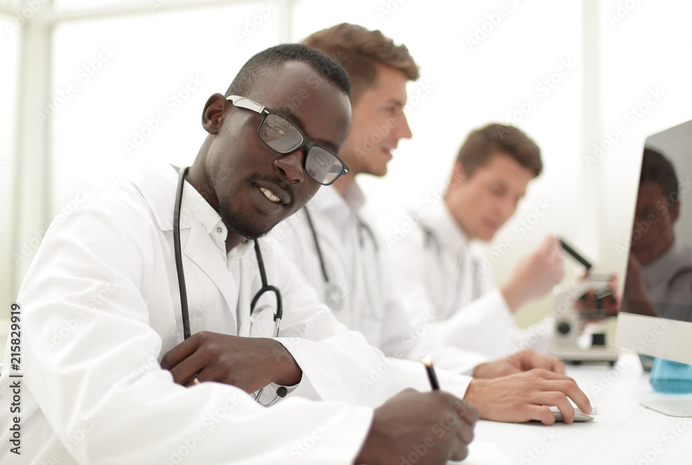 group of doctors sitting in the laboratory group of doctors sitting in the laboratory