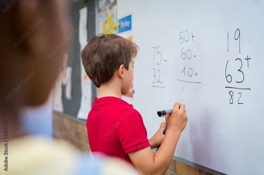 Boy solving math problem - obrazy, fototapety, plakaty 