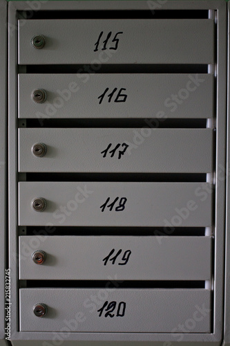 Photography gray metal mailboxes in the entrance of a apartment building
