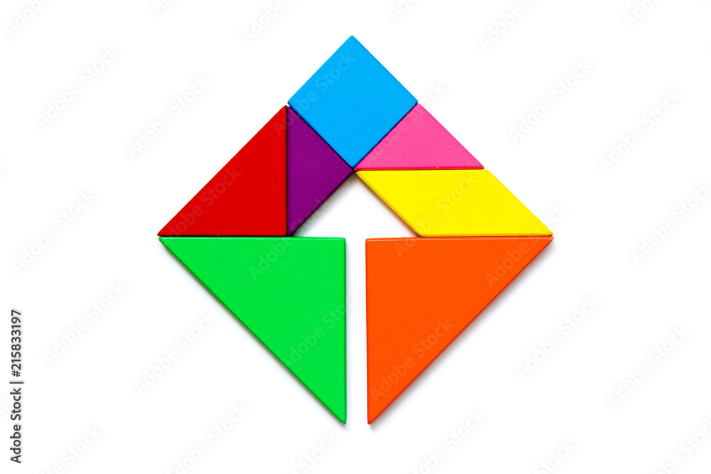Color wood tangram puzzle in square with arrow inside shape on white background Color wood tangram puzzle in square with arrow inside shape on white background