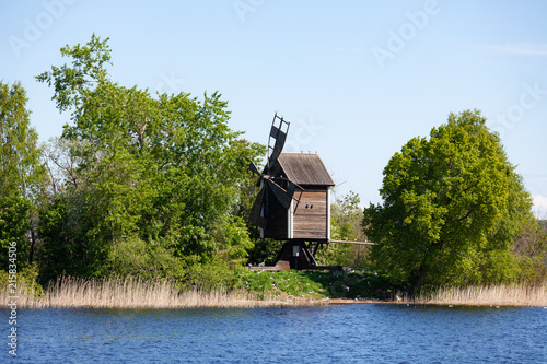 Old wooden windmill in island at summer day photo