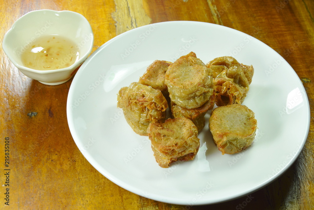 crispy deep fried crab meat roll in flour dipping with plum sauce
