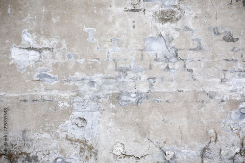 Damaged grey concrete wall exterior background texture © Juhku