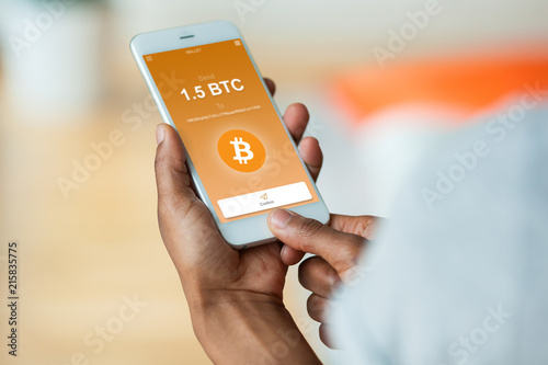 African american person sending a bitcoin btc crypto transaction using  mobile phone wallet - Black people