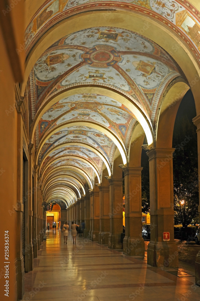 Italy, Bologna night view of an old medieval typical portico in Farini square.