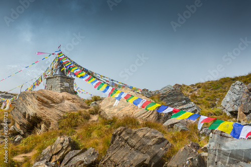 Stupa with prayer flags among a rocky landscape at Annapurna Base Camp, Nepal.