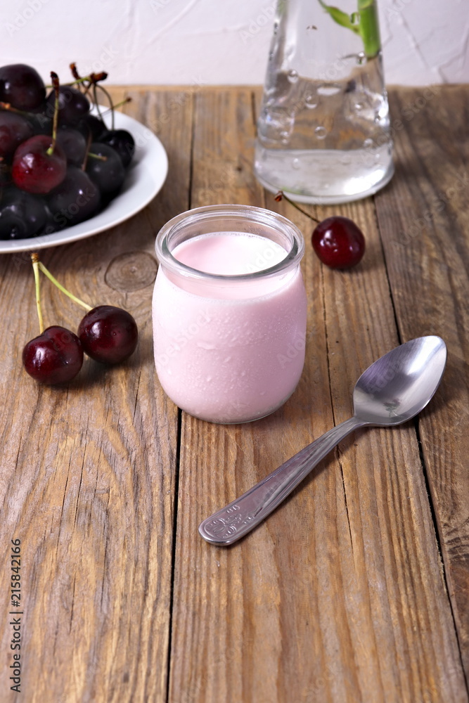 Cherry yogurt in glass, with fresh cherries Cherry yogurt in glass, with fresh cherries