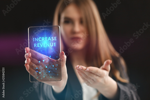 Fototapeta Naklejka Na Ścianę i Meble -  The concept of business, technology, the Internet and the network. A young entrepreneur working on a virtual screen of the future and sees the inscription: Increase revenue