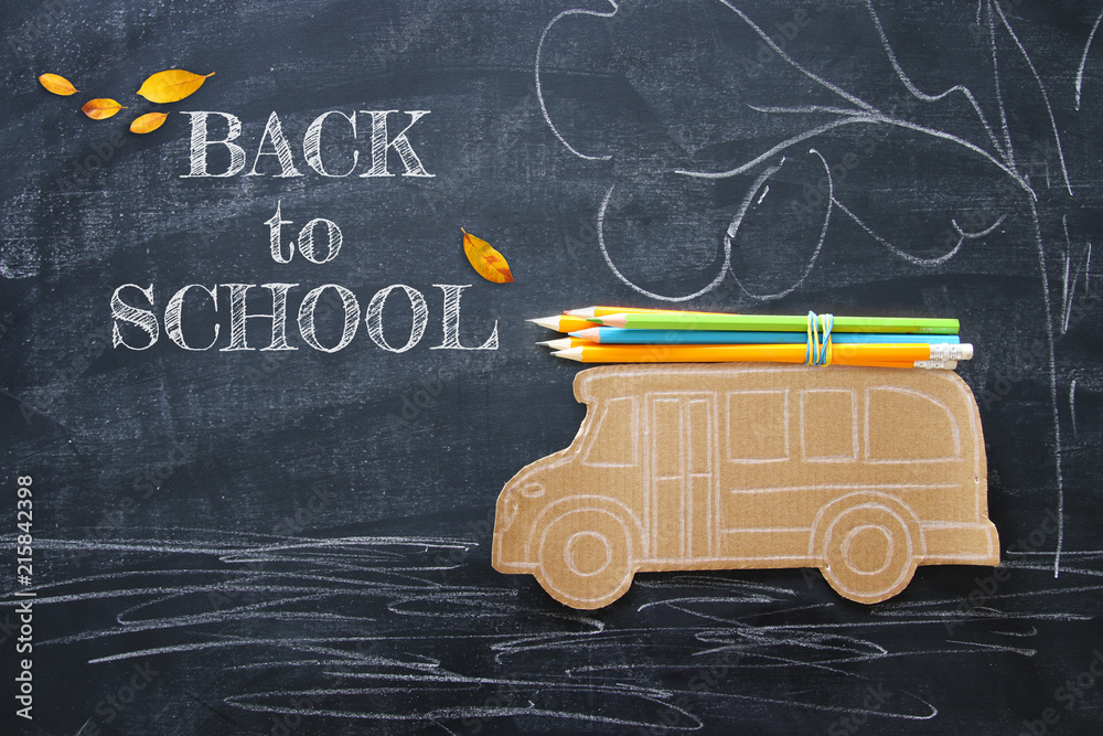 Back to school concept. Top view image school bus and pencils over classroom  blackboard background. Stock Photo | Adobe Stock