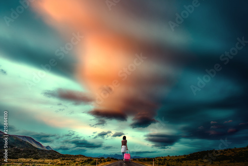 фотографія girl woman run away leaving from home walks alone on the road of countryside, wi