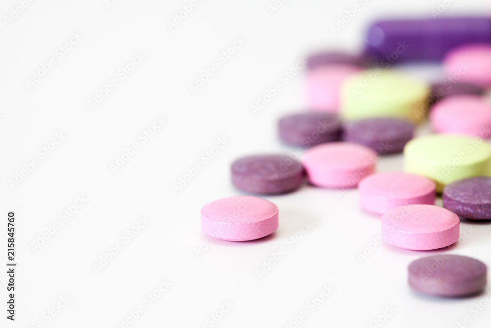 Multicolored vitamin pills. Multicolored vitamin pills.