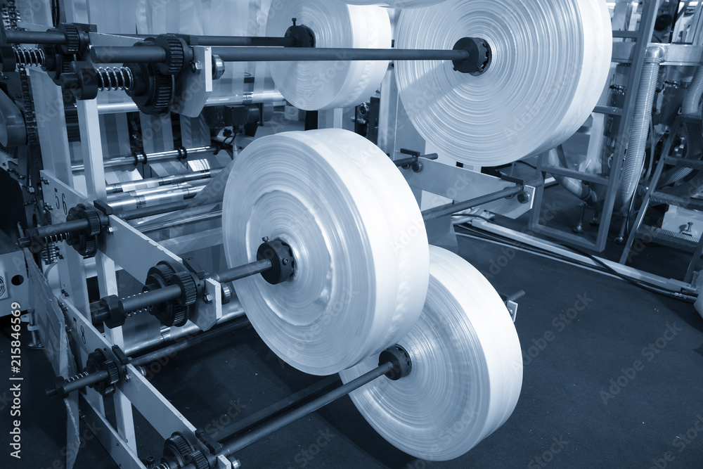 The raw material for plastic bag production.The plastic bag manufacturing process. The raw material for plastic bag production.The plastic bag manufacturing process.
