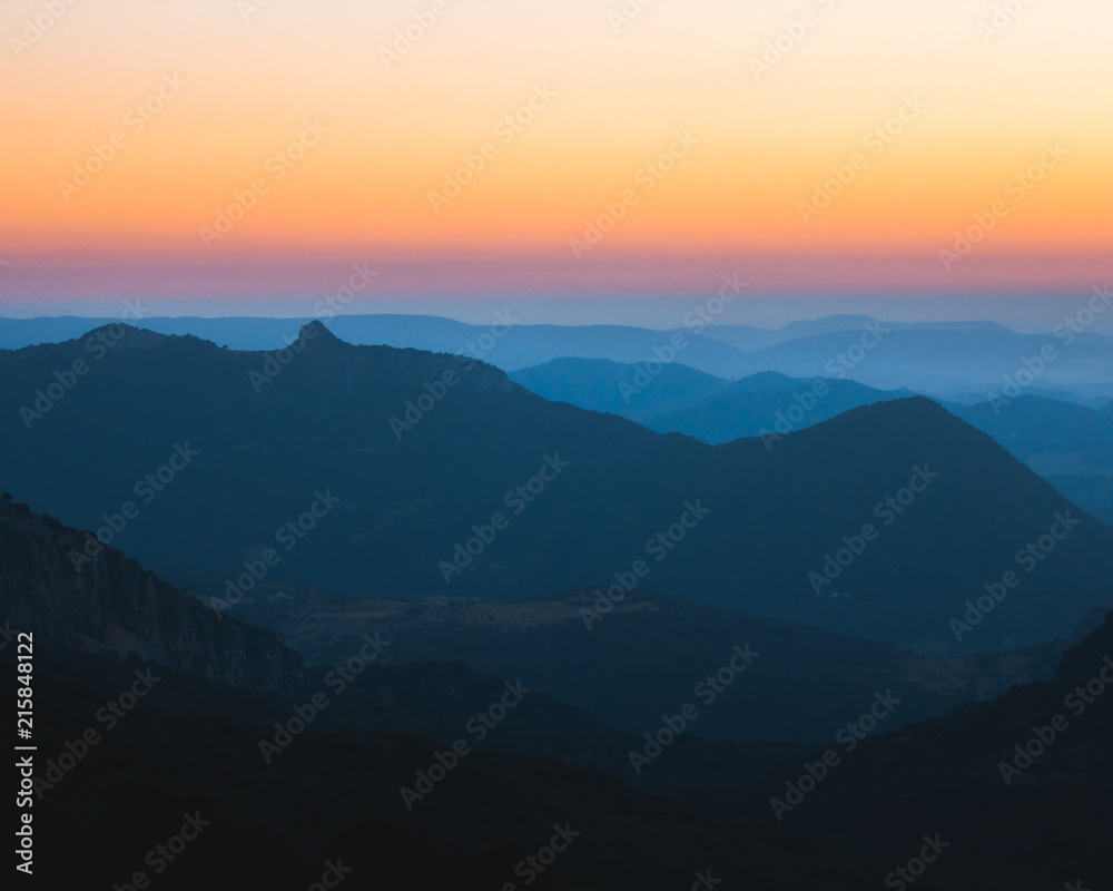 Layers of mountains sunset