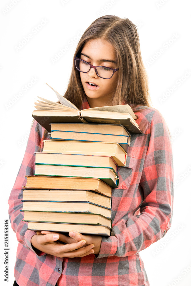 Girl with many books. A student holds a large stack of books. Ubcheba at school. Library. Beginning of studies at the Institute. Young girl with a book in glasses
Girl with many books. A student holds a large stack of books. Ubcheba at school. Library. Beginning of studies at the Institute. Young girl with a book in glasses