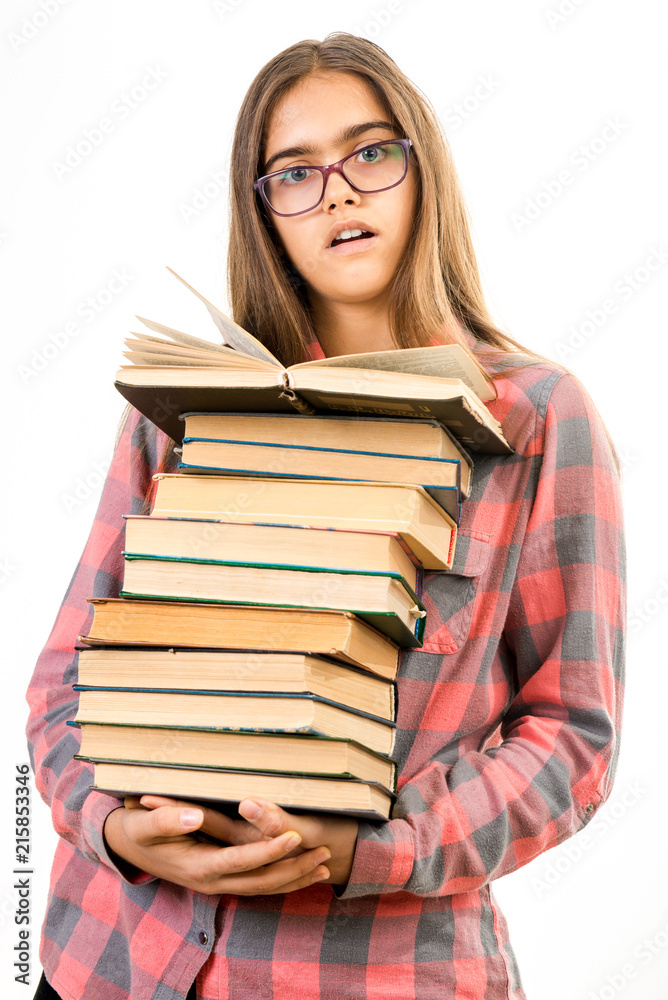 Girl with many books. A student holds a large stack of books. Ubcheba at school. Library. Beginning of studies at the Institute. Young girl with a book in glasses
Girl with many books. A student holds a large stack of books. Ubcheba at school. Library. Beginning of studies at the Institute. Young girl with a book in glasses