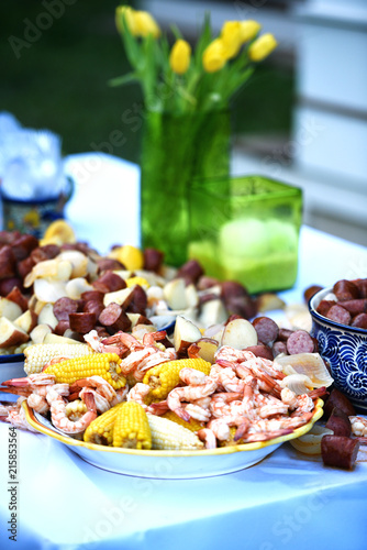 A low-country shrimp boil on an outdoor table. photo