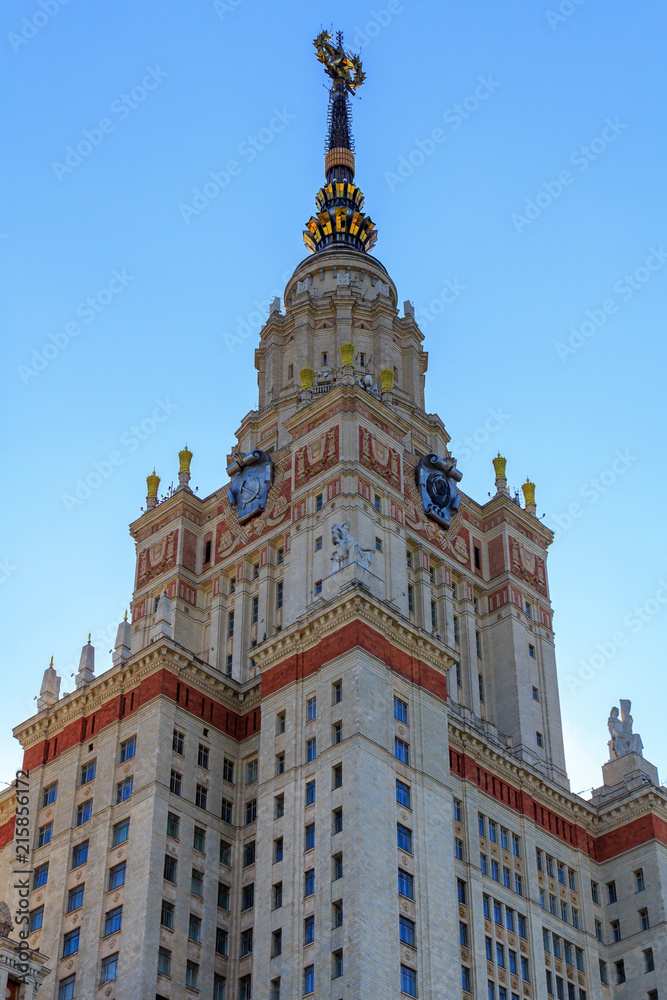 Tower of Lomonosov Moscow State University (MSU) with star on the spire on a blue sky background