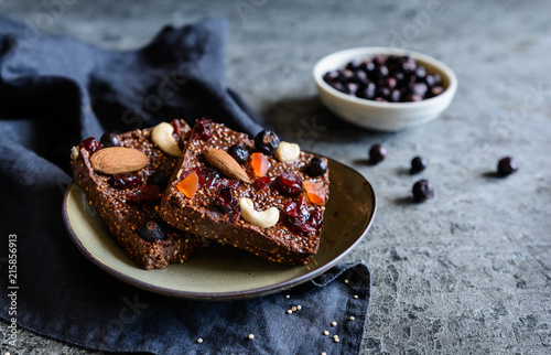 Chocolate puffed quinoa bars with freeze dried black currant, candied papaya, cashew nuts, almonds and cranberries
