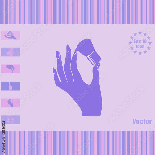 Woman's hand hold thick brush for make up