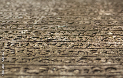 Historical manuscript on stone. Sinhalese language on 12th century wall of Hindu temple. Polonnaruwa, Sri Lanka.