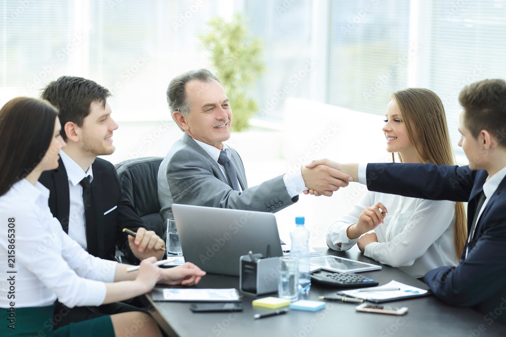 businessman and investor shake hands at the negotiating table businessman and investor shake hands at the negotiating table