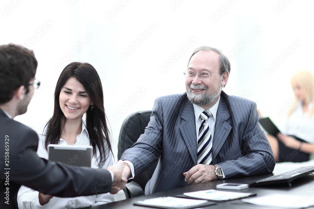 handshake between colleagues in the workplace in the office handshake between colleagues in the workplace in the office