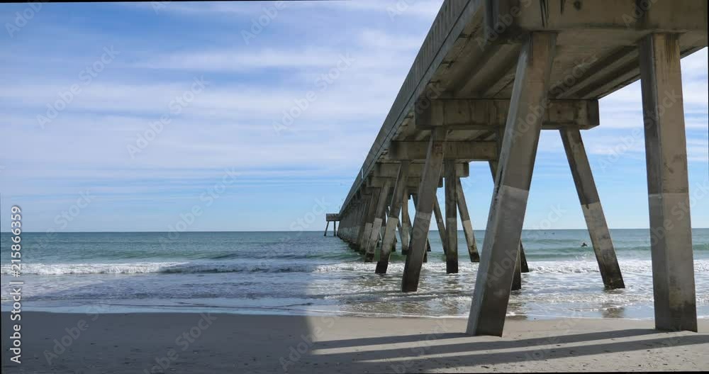 Fishing Pier over the waves and surf at the North Carolina Coast, near Wilmington, NC Fishing Pier over the waves and surf at the North Carolina Coast, near Wilmington, NC
