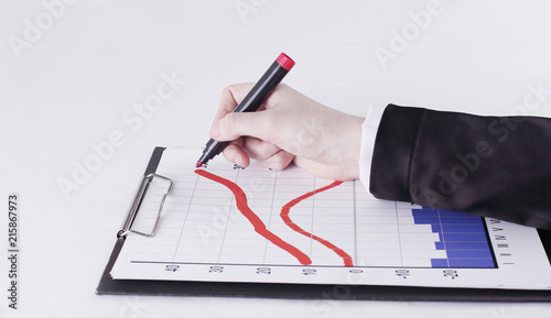 closeup .Businessman drawing a stock chart.isolated on white