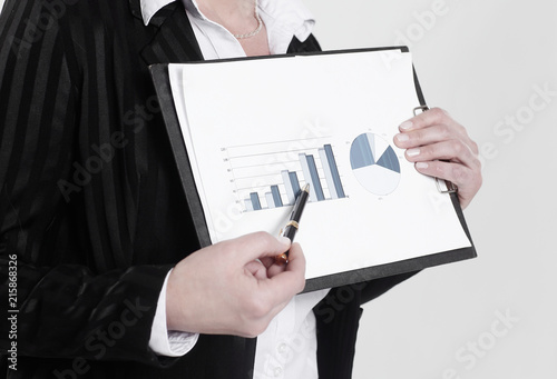 closeup.business woman showing graph on financial.