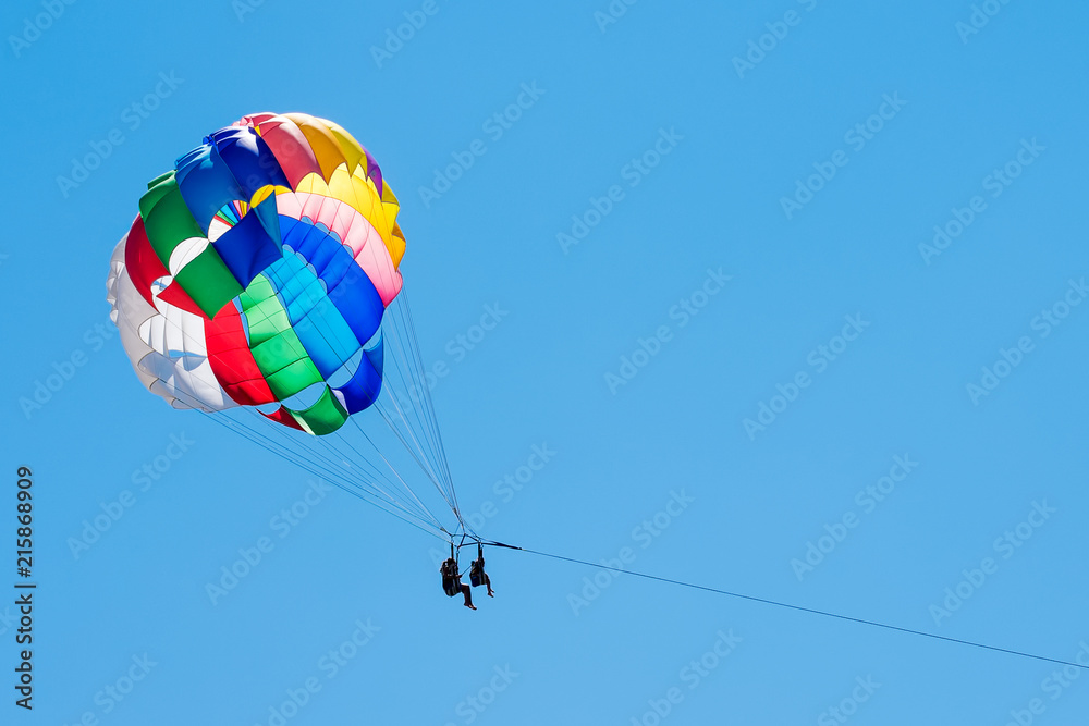 towed parachute against the sky on a summer day towed parachute against the sky on a summer day