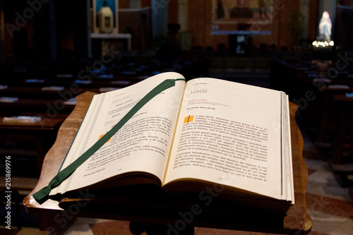 Pavia, Italy. 2 February 2018. An open Bible for the visitors to read today's lecture in a Catholic church.