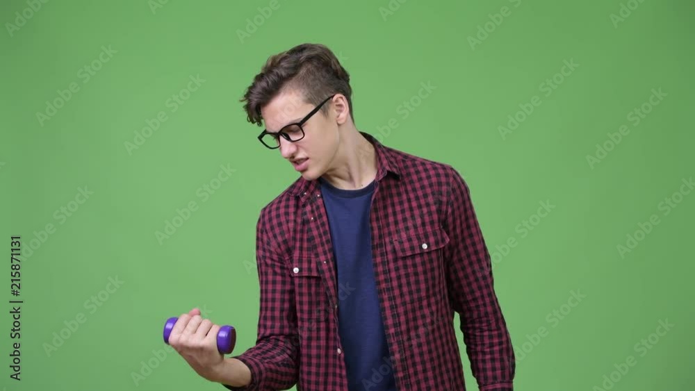 Young handsome teenage nerd boy exercising Young handsome teenage nerd boy exercising
