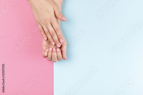 female hands with pink manicure