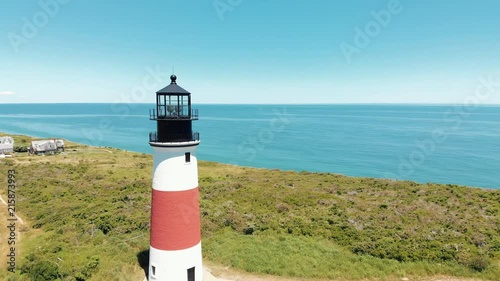 Aerial drone shot of a coastal lighthouse on Nantucket island in Massachusetts. photo