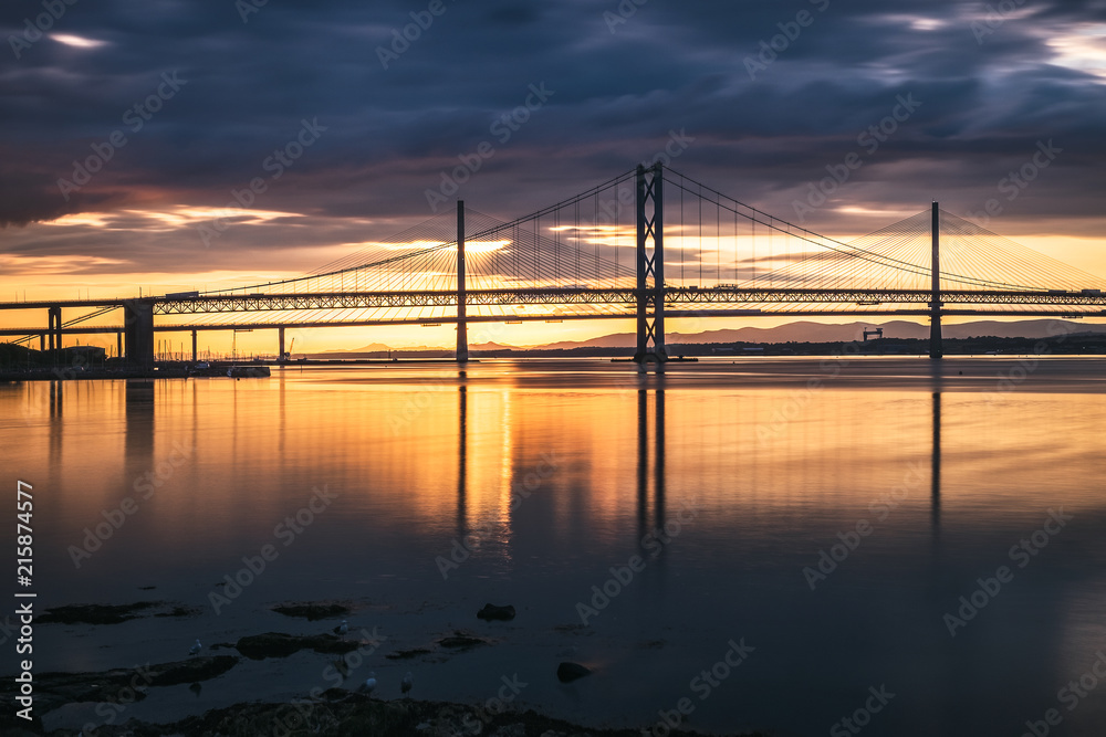 Night view of the Forth Road Bridge and Queensferry Crossing in Edinburgh