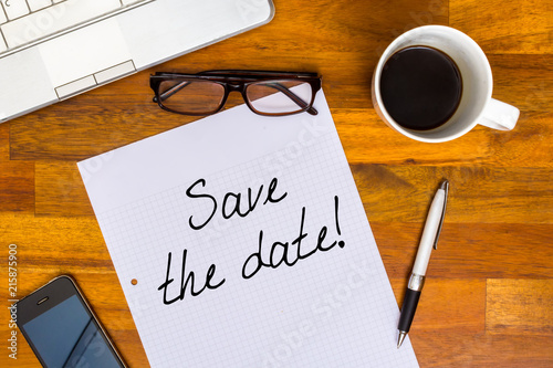 Save the date - written on white paper - office look