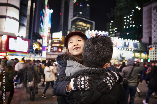 Girl with father in big city