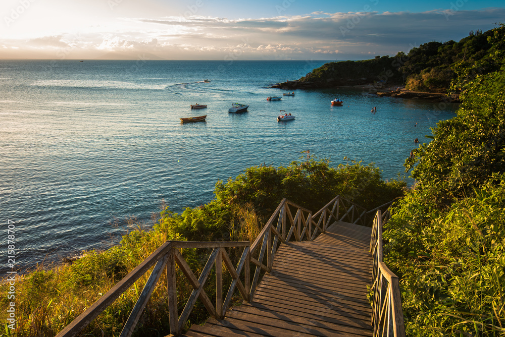 Fototapeta premium Wooden Stairs Leading to the Azeda Beach by Sunset in Buzios, Brazil